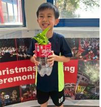 This boy used recycled plastic bottles to make planters and learned how to reuse resources.
