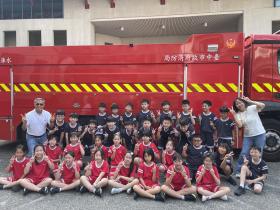 A happy photo beside the fire truck.